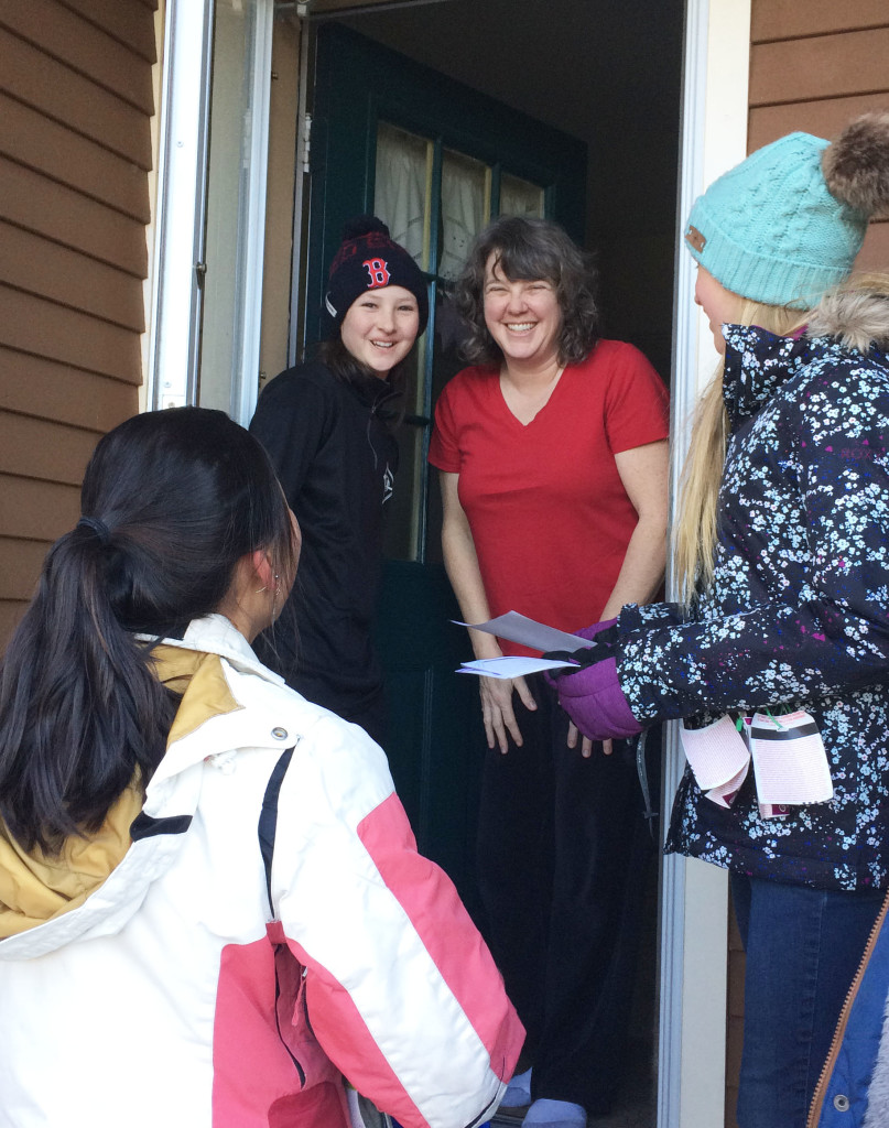 MLK resident giving food at door